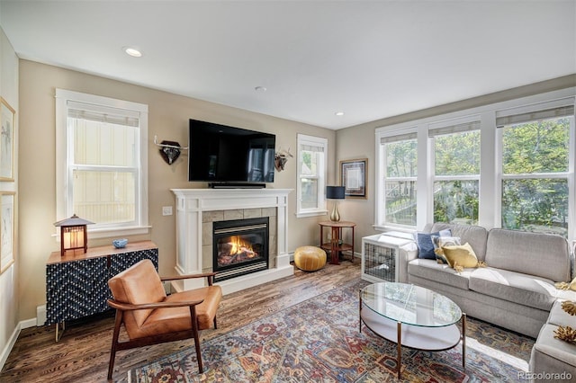 17 Meadow Lark Grn, Breckenridge, CO 80424 - living area featuring wood finished floors, a tile fireplace, recessed lighting, and radiator