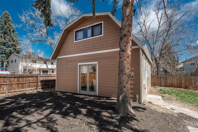 8170 S Marshall Ct, Littleton, CO 80128 - back of house featuring a fenced backyard and french doors