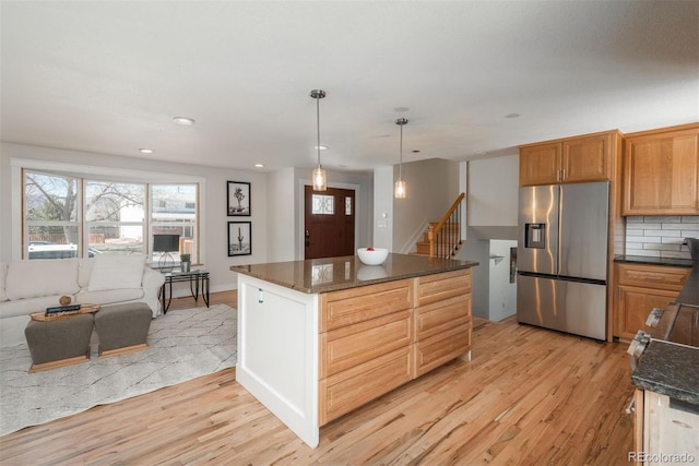 8170 S Marshall Ct, Littleton, CO 80128 - kitchen featuring plenty of natural light, light wood finished floors, a center island, and stainless steel fridge with ice dispenser