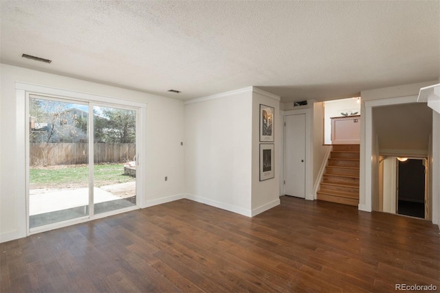 8170 S Marshall Ct, Littleton, CO 80128 - unfurnished living room with a textured ceiling, stairs, baseboards, wood finished floors, and visible vents