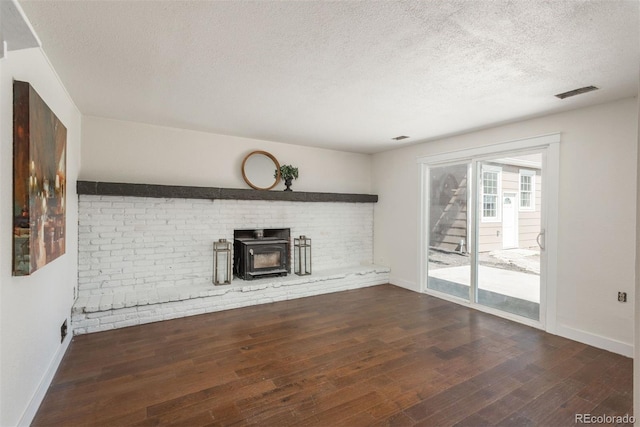 8170 S Marshall Ct, Littleton, CO 80128 - unfurnished living room with wood-type flooring, a textured ceiling, and baseboards