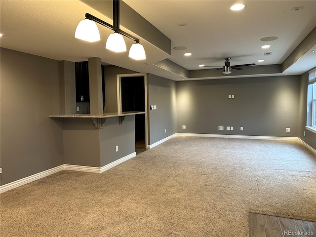 spare room featuring carpet, ceiling fan, baseboards, and recessed lighting