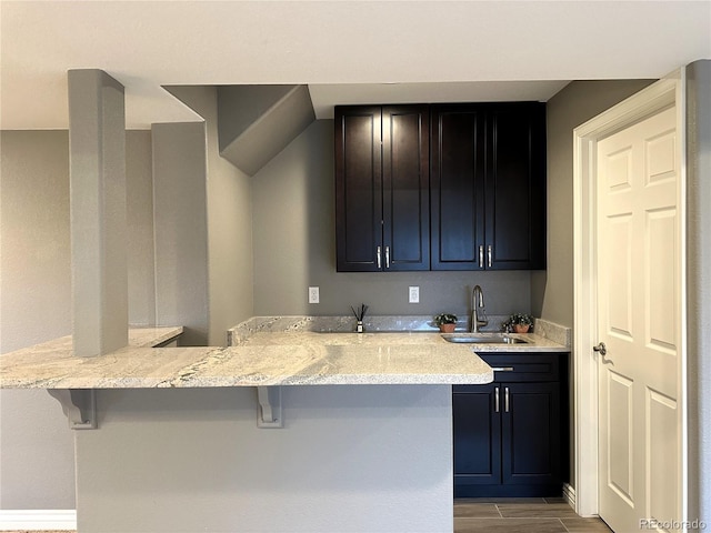 indoor wet bar with wood finished floors