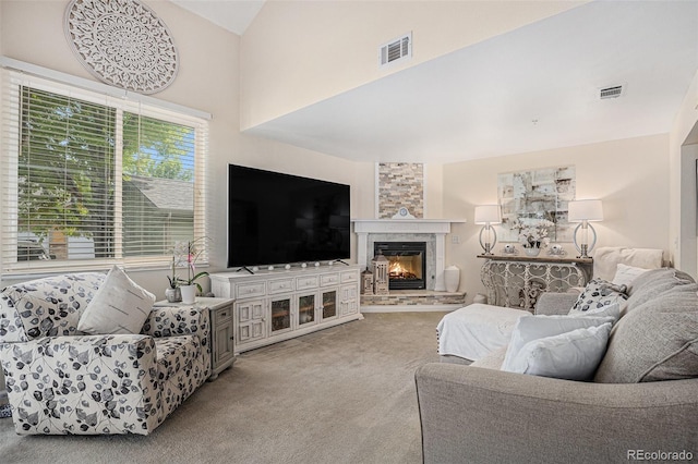 2900 Purcell St Unit 6, Brighton, CO 80601 - carpeted living area featuring a fireplace and vaulted ceiling