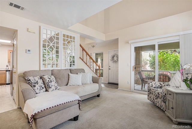 2900 Purcell St Unit 6, Brighton, CO 80601 - living room featuring stairs and light colored carpet
