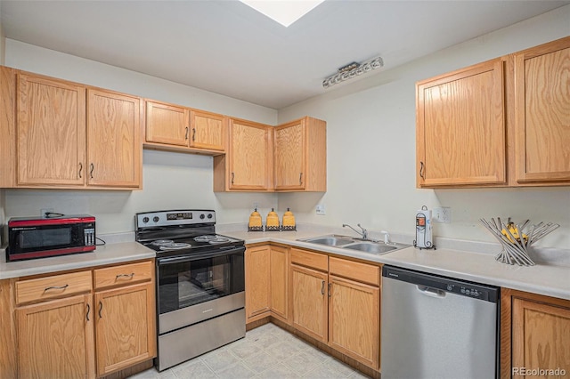 2900 Purcell St Unit 6, Brighton, CO 80601 - kitchen featuring stainless steel appliances, light countertops, and light brown cabinetry
