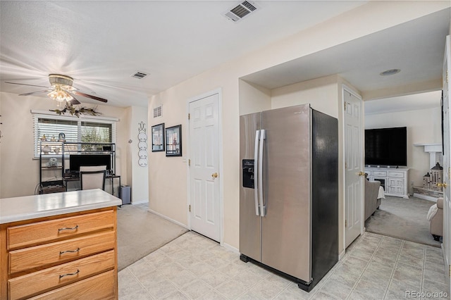 2900 Purcell St Unit 6, Brighton, CO 80601 - kitchen with stainless steel fridge with ice dispenser, ceiling fan, light carpet, and light countertops