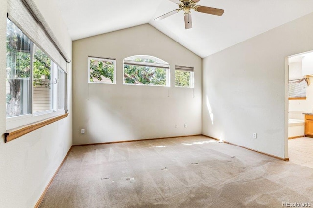 unfurnished room with baseboards, lofted ceiling, carpet, and ceiling fan