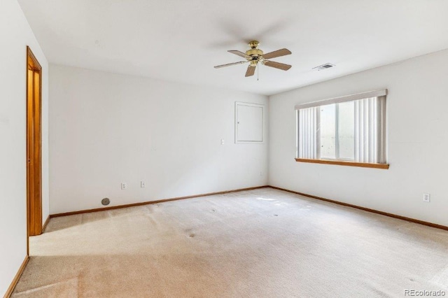 unfurnished room with a ceiling fan, baseboards, visible vents, and carpet floors