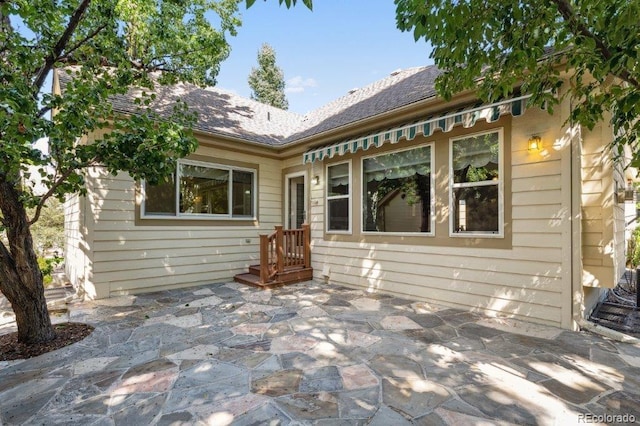 rear view of house with a patio