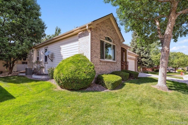 view of home's exterior with a garage, brick siding, cooling unit, and a lawn