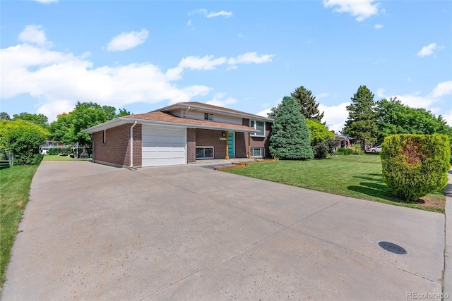 8333 Depew Way, Arvada, CO 80003 - view of front of house featuring brick siding, a garage, driveway, and a front lawn
