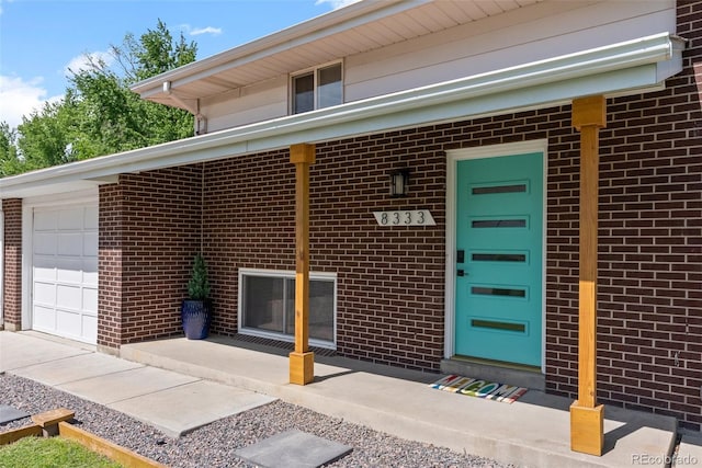 8333 Depew Way, Arvada, CO 80003 - property entrance with brick siding and a garage