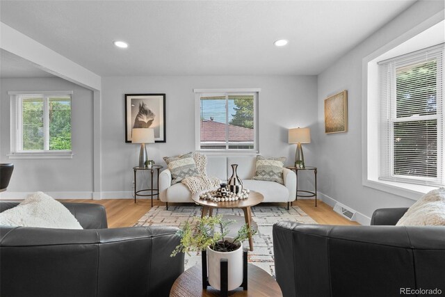 8333 Depew Way, Arvada, CO 80003 - living area with baseboards, wood finished floors, and recessed lighting