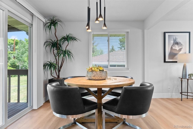 8333 Depew Way, Arvada, CO 80003 - dining area with plenty of natural light, light wood finished floors, and baseboards