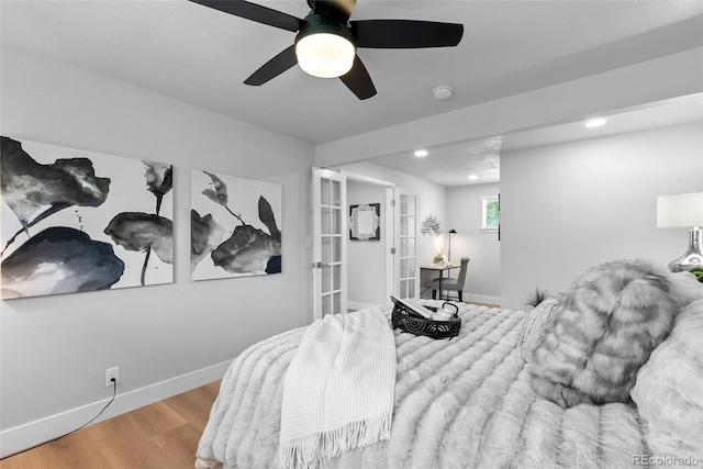 8333 Depew Way, Arvada, CO 80003 - bedroom with baseboards, french doors, wood finished floors, recessed lighting, and ceiling fan