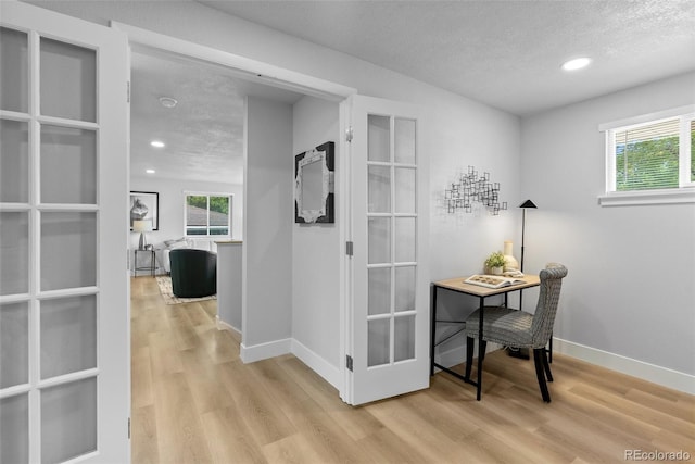 8333 Depew Way, Arvada, CO 80003 - office featuring plenty of natural light, wood finished floors, a textured ceiling, french doors, and recessed lighting