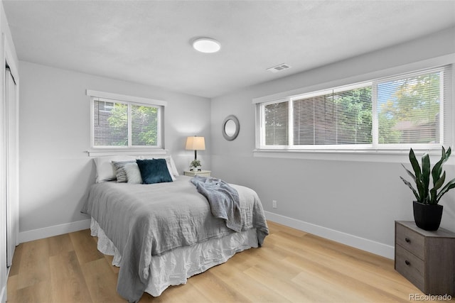 8333 Depew Way, Arvada, CO 80003 - bedroom featuring baseboards and wood finished floors