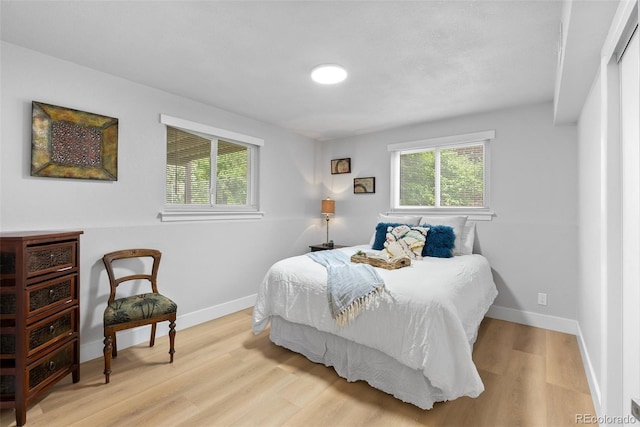 8333 Depew Way, Arvada, CO 80003 - bedroom featuring wood finished floors and baseboards