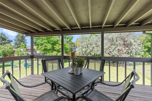 8333 Depew Way, Arvada, CO 80003 - wooden terrace featuring outdoor dining space and a lawn