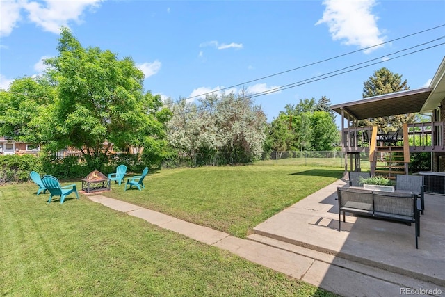 8333 Depew Way, Arvada, CO 80003 - view of yard with a patio area, a deck, and an outdoor living space with a fire pit
