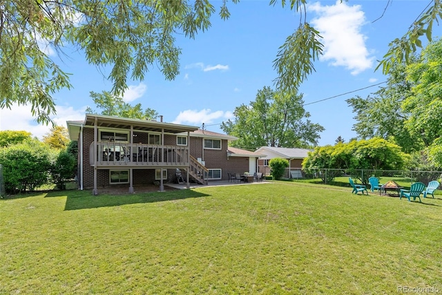 8333 Depew Way, Arvada, CO 80003 - view of yard featuring an outdoor fire pit, stairs, a wooden deck, and a patio area