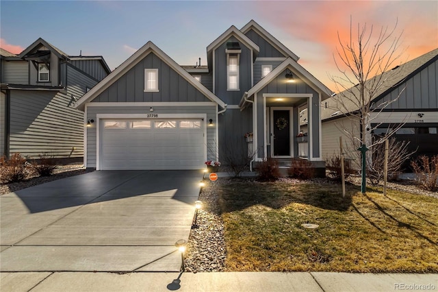 view of front of house featuring concrete driveway, a garage, and board and batten siding