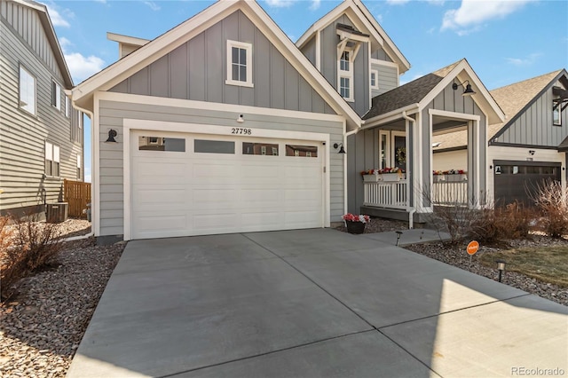 view of front of home featuring board and batten siding, concrete driveway, and an attached garage