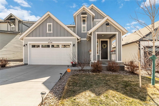 view of front of house featuring a garage, board and batten siding, and driveway