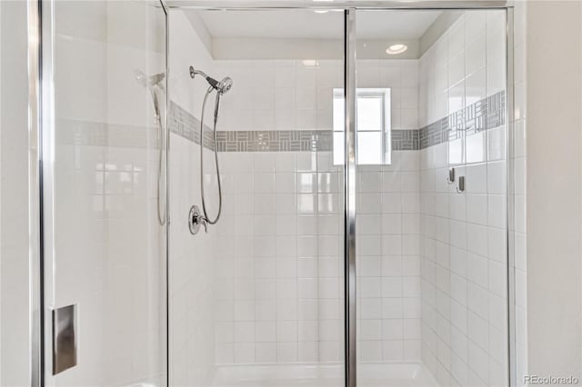 full bath with a shower stall