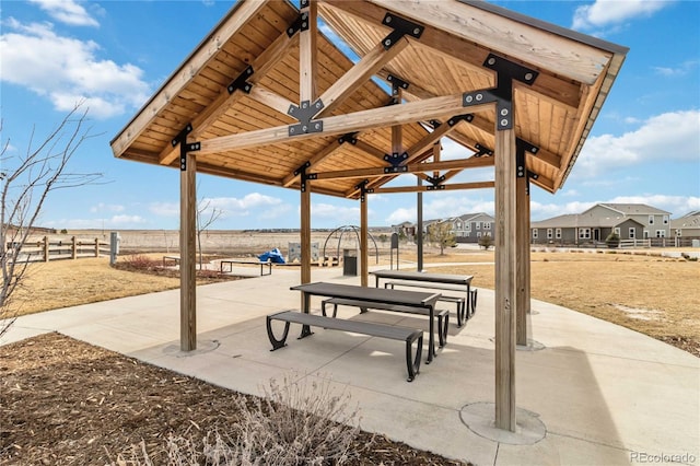 view of community with a gazebo and fence