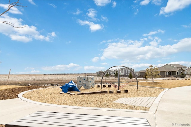 community jungle gym with a residential view