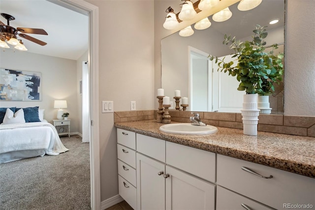 15580 Rigge Ct, Elbert, CO 80106 - ensuite bathroom featuring vanity, a ceiling fan, and baseboards