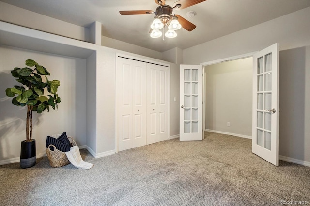 15580 Rigge Ct, Elbert, CO 80106 - unfurnished bedroom with french doors, carpet, a closet, ceiling fan, and baseboards