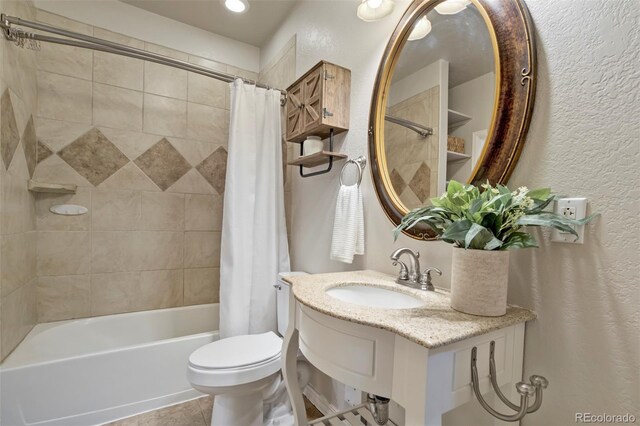 15580 Rigge Ct, Elbert, CO 80106 - full bathroom featuring a sink, a textured wall, toilet, shower / bath combo with shower curtain, and tile patterned floors