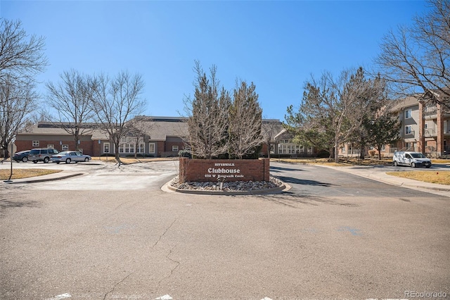 view of street with a residential view, curbs, and sidewalks