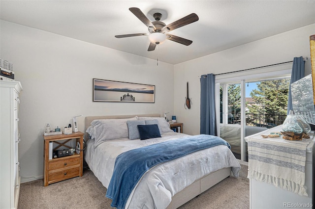 bedroom featuring access to exterior, light carpet, and a ceiling fan