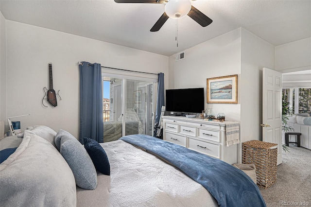 carpeted bedroom with access to outside, visible vents, and ceiling fan