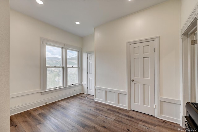 empty room with recessed lighting and wood finished floors