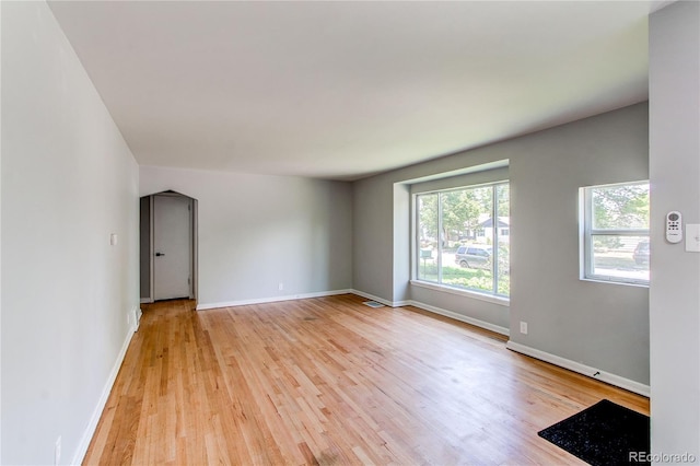 1170 Kingston St, Aurora, CO 80010 - spare room featuring baseboards and light wood-type flooring