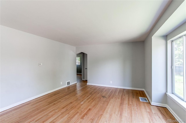 1170 Kingston St, Aurora, CO 80010 - spare room featuring plenty of natural light, light wood-type flooring, and baseboards