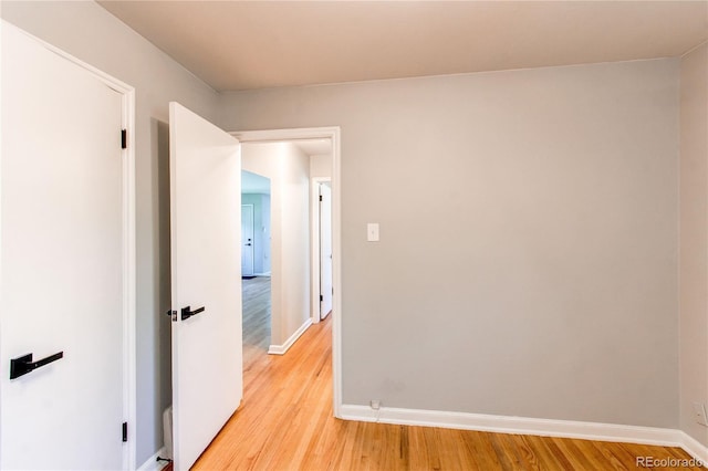 1170 Kingston St, Aurora, CO 80010 - empty room with baseboards and light wood-style floors