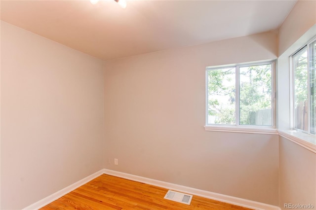 1170 Kingston St, Aurora, CO 80010 - spare room with baseboards and light wood-type flooring
