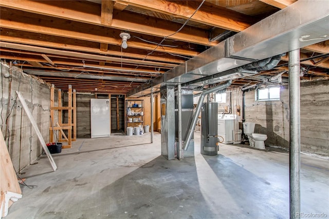 1170 Kingston St, Aurora, CO 80010 - below grade area with washer and dryer, water heater, and a water softener