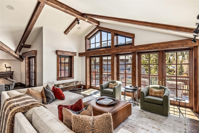 interior space featuring plenty of natural light, french doors, beam ceiling, and high vaulted ceiling