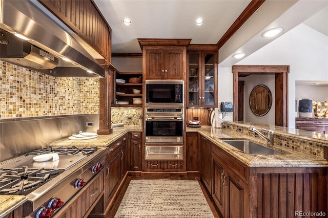 kitchen with ventilation hood, a sink, tasteful backsplash, a warming drawer, and appliances with stainless steel finishes