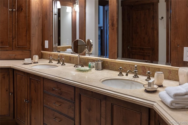 full bath featuring double vanity and a sink