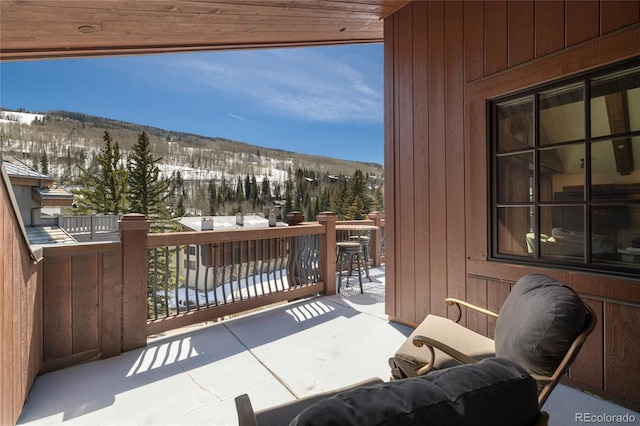 view of snow covered back of property