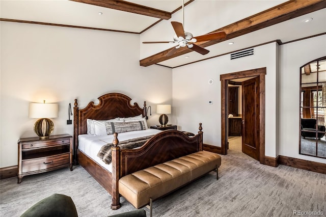 bedroom with visible vents, vaulted ceiling with beams, baseboards, and ceiling fan