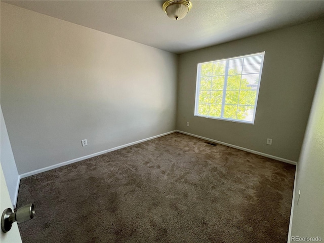 20558 E Grand Ln, Aurora, CO 80015 - spare room with baseboards and carpet flooring